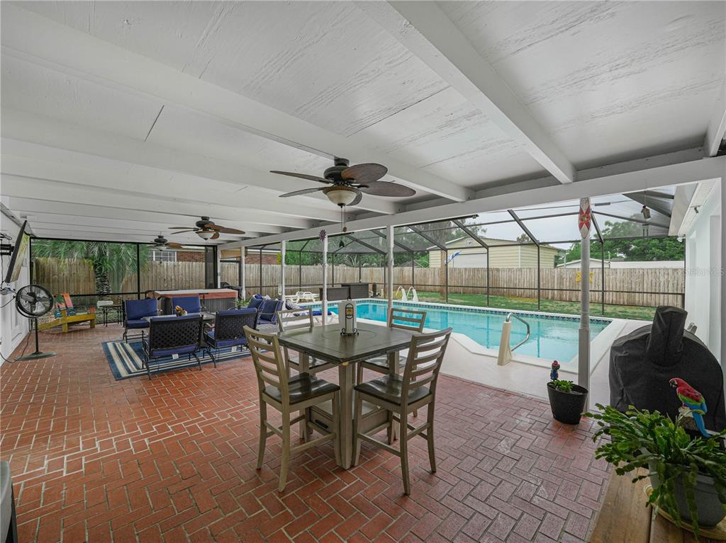 4615 Kings Point Court Lakeland, FL 33813 - Photo 32 of 41 a view of a patio with a table chairs and a backyard