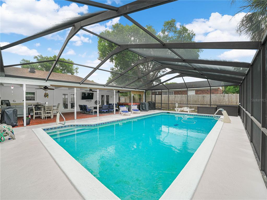 4615 Kings Point Court Lakeland, FL 33813 - Photo 34 of 41 a view of a swimming pool with a patio