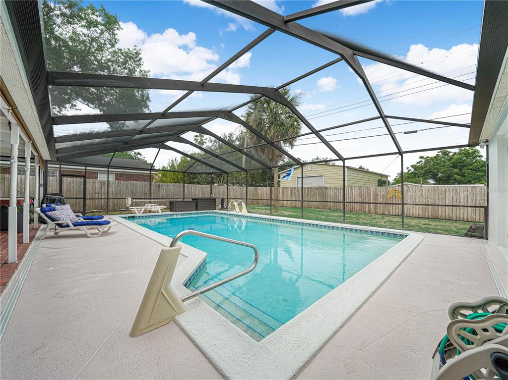 4615 Kings Point Court Lakeland, FL 33813 - Photo 36 of 41 a view of a swimming pool with a patio and deck