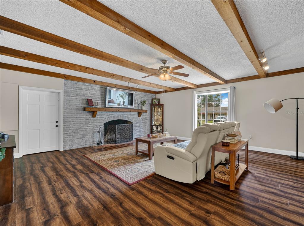 4615 Kings Point Court Lakeland, FL 33813 - Photo 6 of 41 a living room with furniture and a fireplace