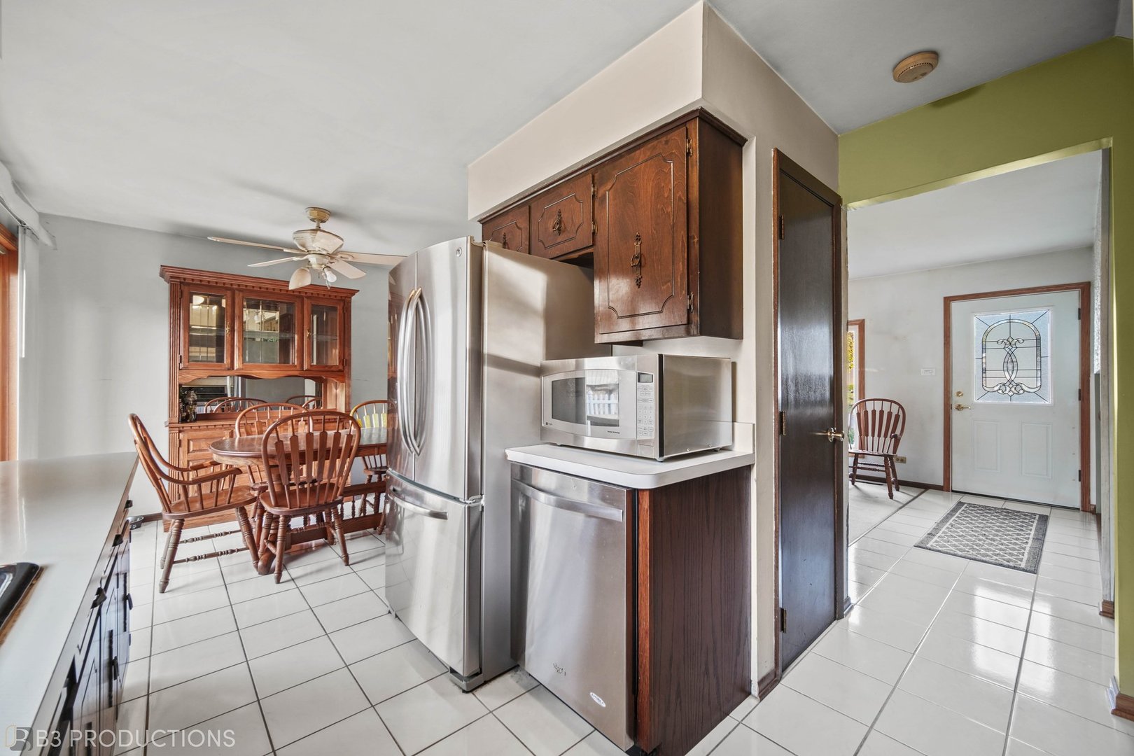 15548 Long Avenue Oak Forest, IL 60452 - Photo 5 of 15 a kitchen with stainless steel appliances kitchen island granite countertop a refrigerator and cabinets