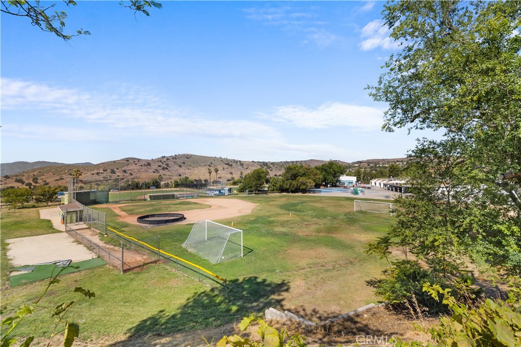 26096 Adamor Road Calabasas, CA 91302 - Photo 58 of 61 Views from back yard seat wall. Make the ball fields your own for kickball, frisbee, flashlight tag at night! Access through trellis along back wall.