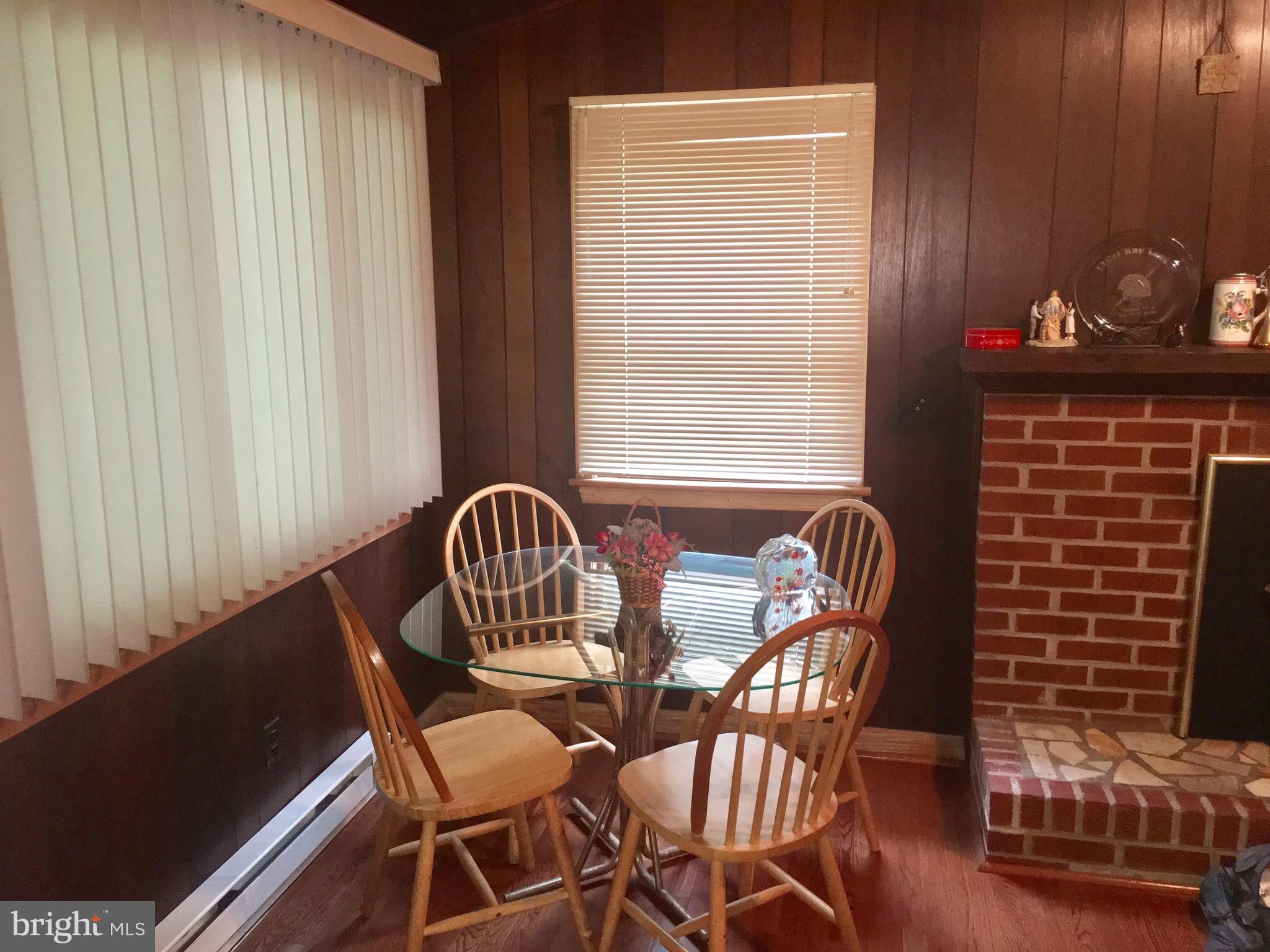 3609 Howellsville Road Front Royal, VA 22630 - Photo 3 of 18 a view of a dining room with furniture and chandelier