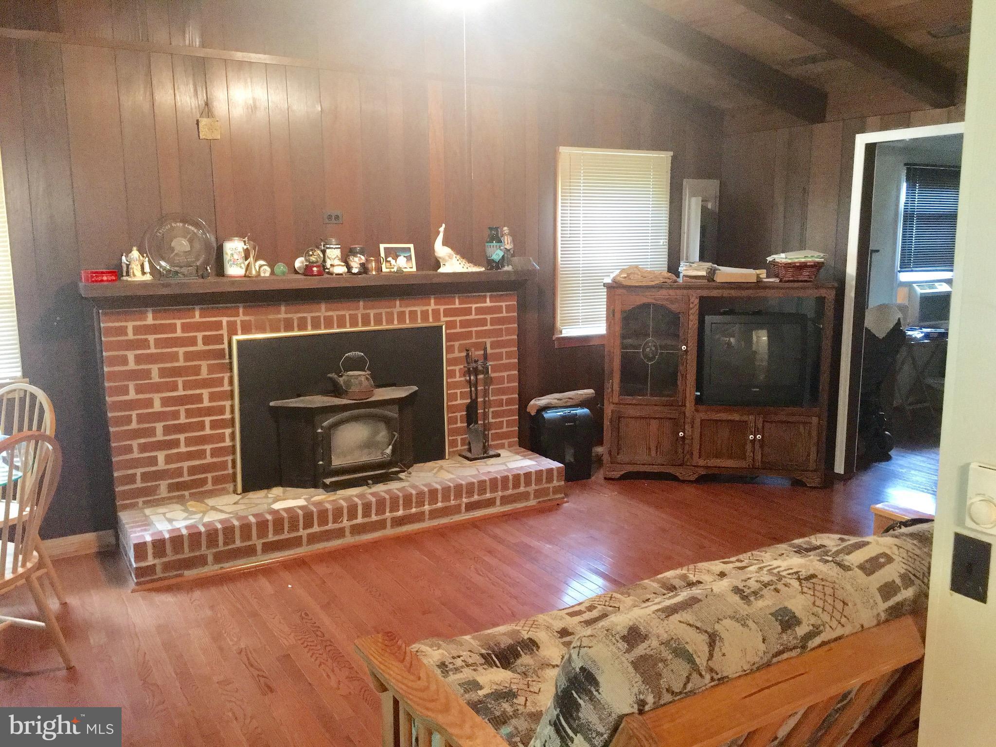 3609 Howellsville Road Front Royal, VA 22630 - Photo 4 of 18 a living room with furniture and a fireplace