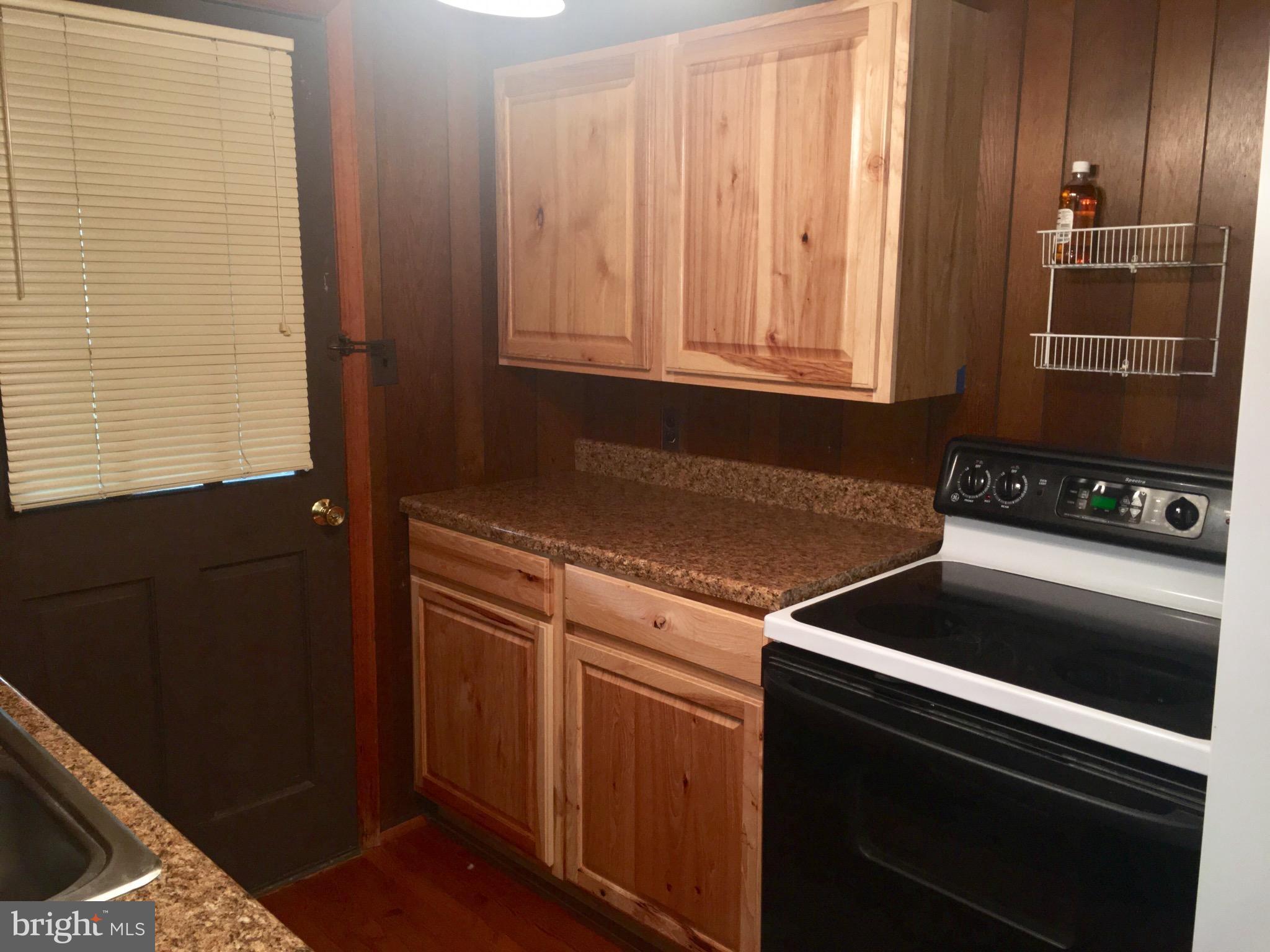 3609 Howellsville Road Front Royal, VA 22630 - Photo 6 of 18 a kitchen with granite countertop cabinets and black stainless steel appliances
