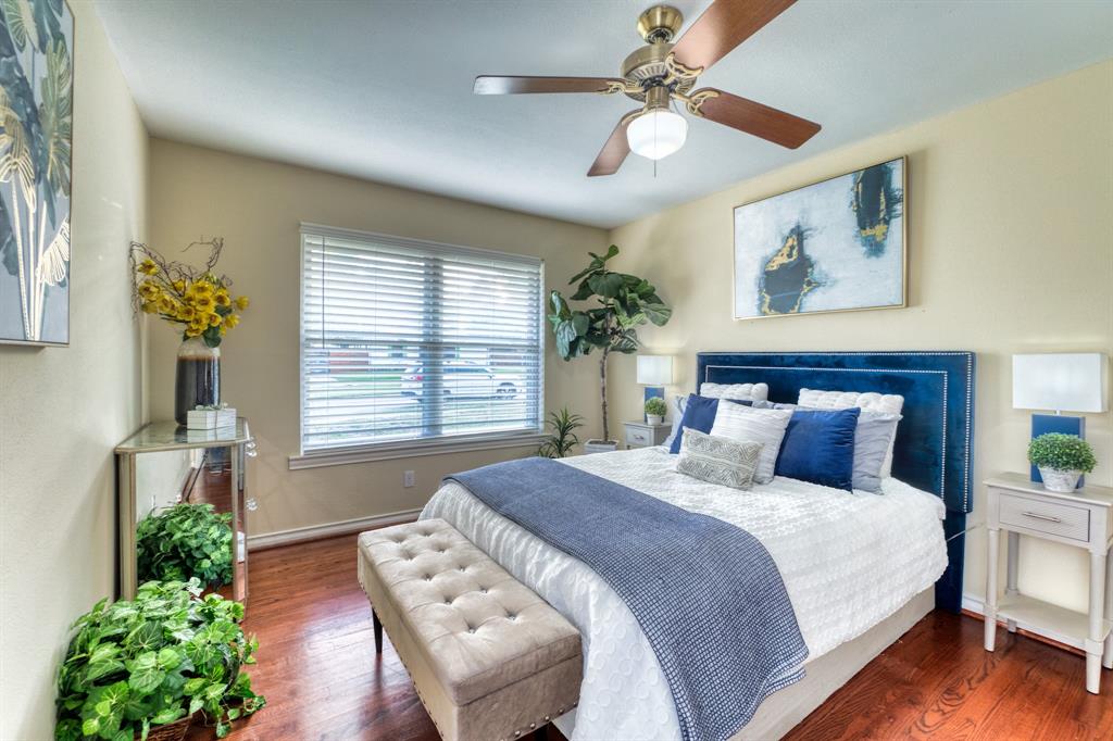 314 Easton Road Dallas, TX 75218 - Photo 13 of 26 a bedroom with a large bed and a window