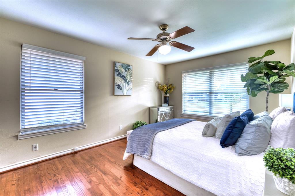 314 Easton Road Dallas, TX 75218 - Photo 14 of 26 a bedroom with a large bed and a window