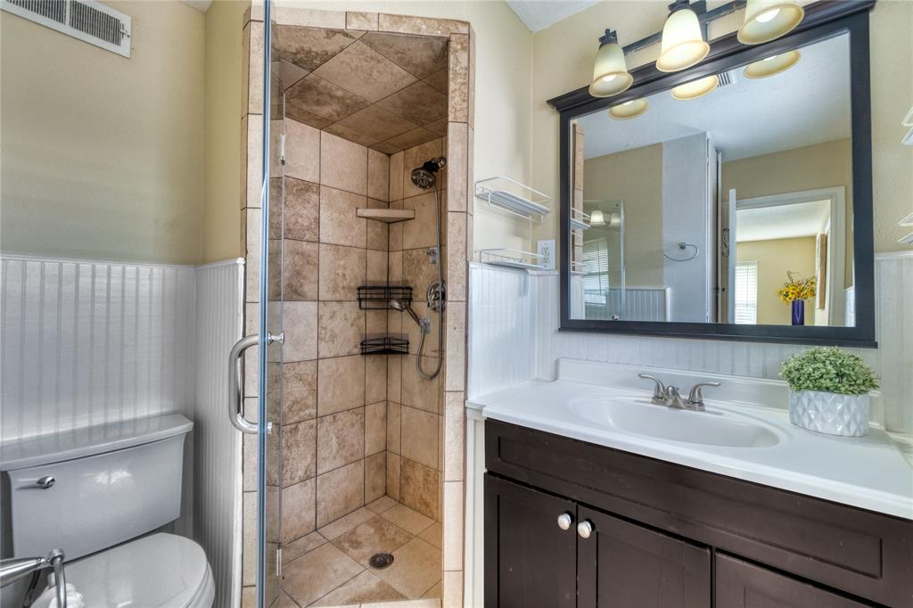 314 Easton Road Dallas, TX 75218 - Photo 15 of 26 a bathroom with a sink a toilet and shower