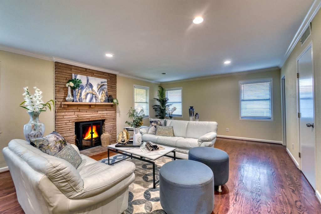 314 Easton Road Dallas, TX 75218 - Photo 16 of 26 a living room with furniture and a fireplace