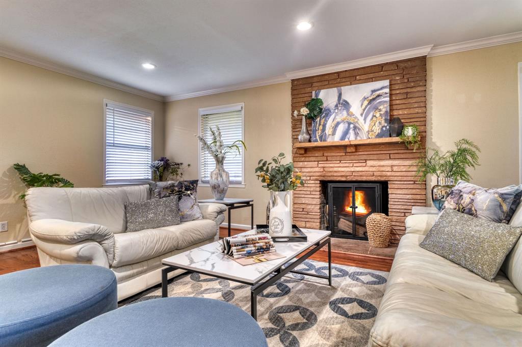314 Easton Road Dallas, TX 75218 - Photo 17 of 26 a living room with furniture fireplace and window