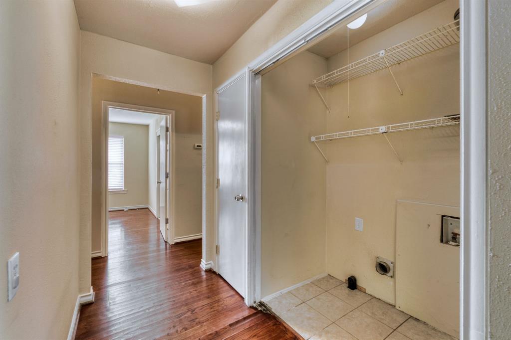 314 Easton Road Dallas, TX 75218 - Photo 19 of 26 a view of a room with wooden floor and a bathroom