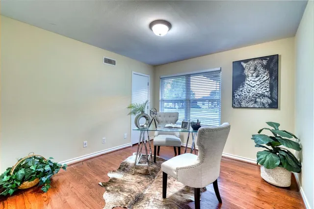 a view of a livingroom with furniture and a potted plant