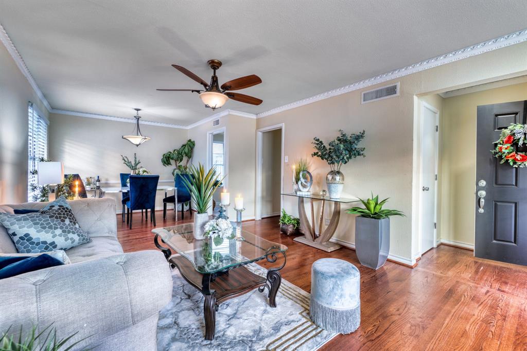 314 Easton Road Dallas, TX 75218 - Photo 4 of 26 a living room with furniture and a wooden floor