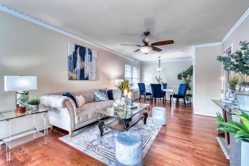 314 Easton Road Dallas, TX 75218 - Photo 5 of 26 a living room with furniture and a chandelier