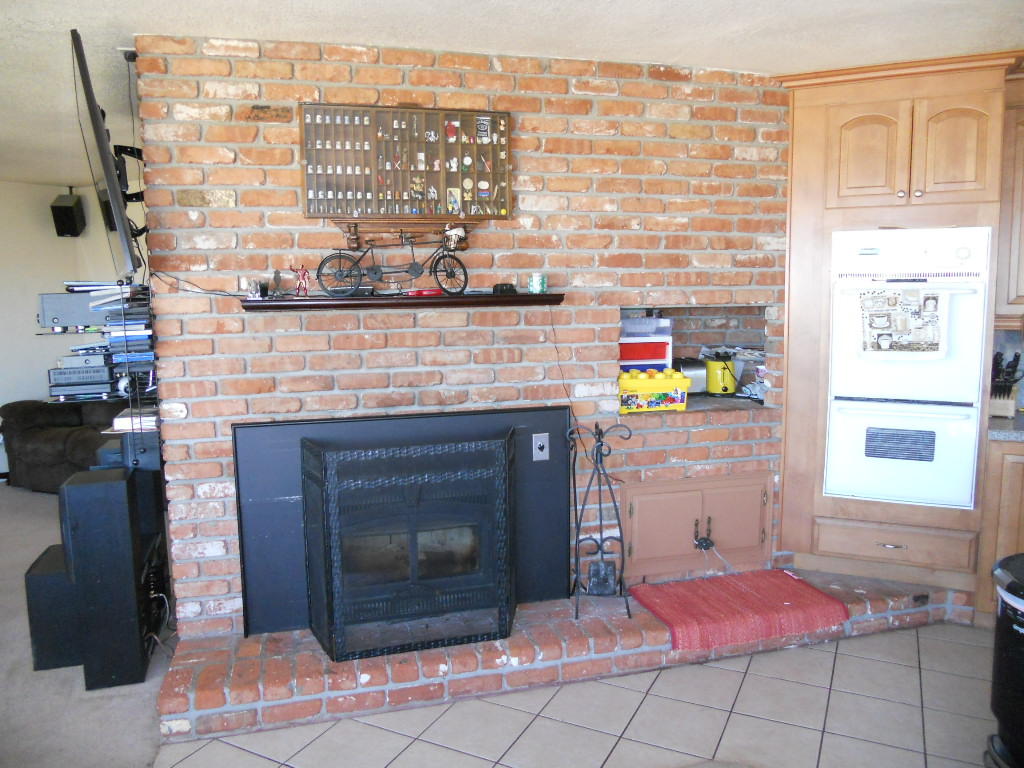 22712 Mariposa Road Tehachapi, CA 93561 - Photo 5 of 21 a dining room with a fireplace and a table