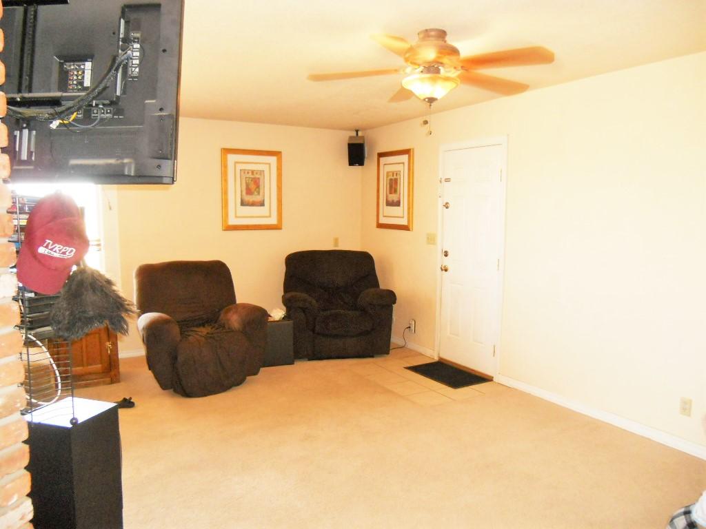 22712 Mariposa Road Tehachapi, CA 93561 - Photo 6 of 21 a bedroom with a bed and a chandelier
