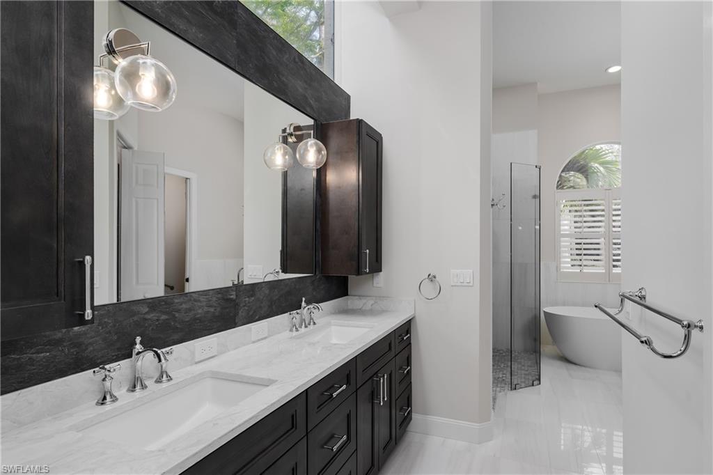 2280 Hawks Ridge Loop Naples, FL 34105 - Photo 19 of 33 Bathroom with vanity and a bath