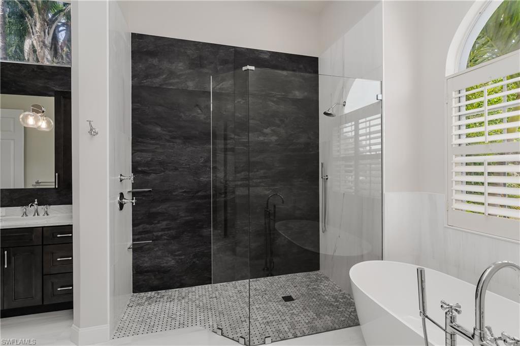2280 Hawks Ridge Loop Naples, FL 34105 - Photo 22 of 33 Bathroom with vanity and shower with separate bathtub