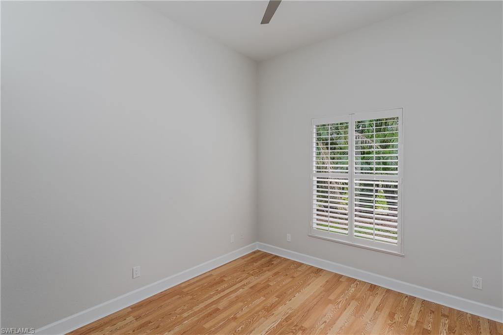 2280 Hawks Ridge Loop Naples, FL 34105 - Photo 24 of 33 Spare room featuring ceiling fan and light hardwood / wood-style flooring