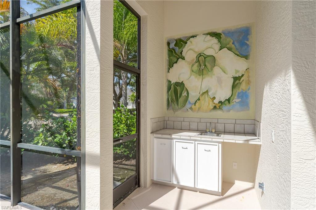 2280 Hawks Ridge Loop Naples, FL 34105 - Photo 33 of 33 Unfurnished sunroom featuring sink