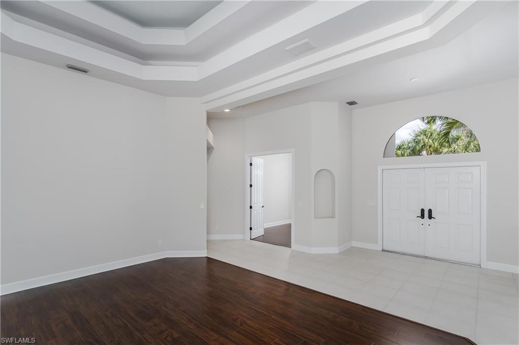 2280 Hawks Ridge Loop Naples, FL 34105 - Photo 6 of 33 Entryway with wood-type flooring