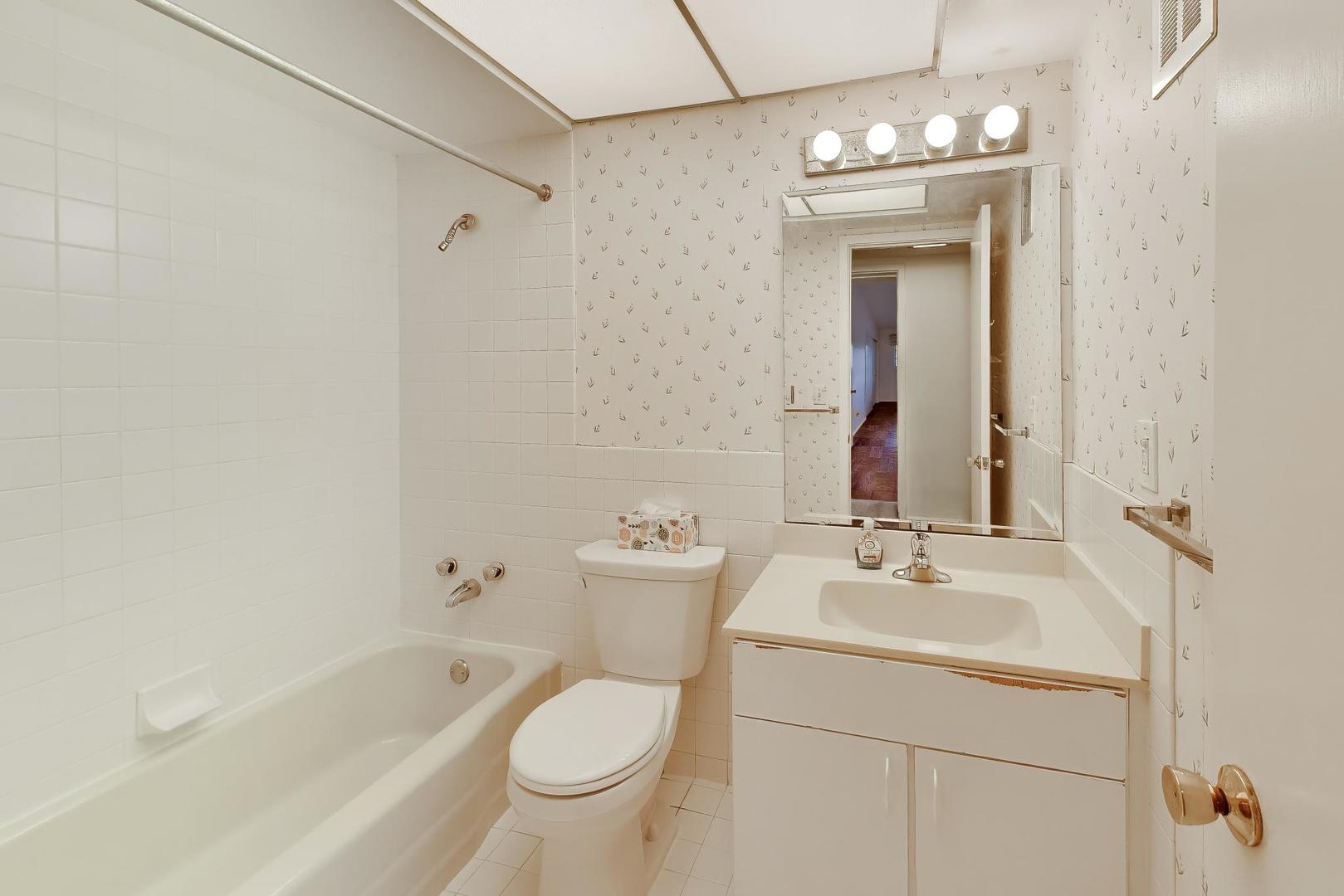 1056 Van Tassel Road Sleepy Hollow, IL 60118 - Photo 19 of 34 a bathroom with a bathtub shower sink mirror and toilet
