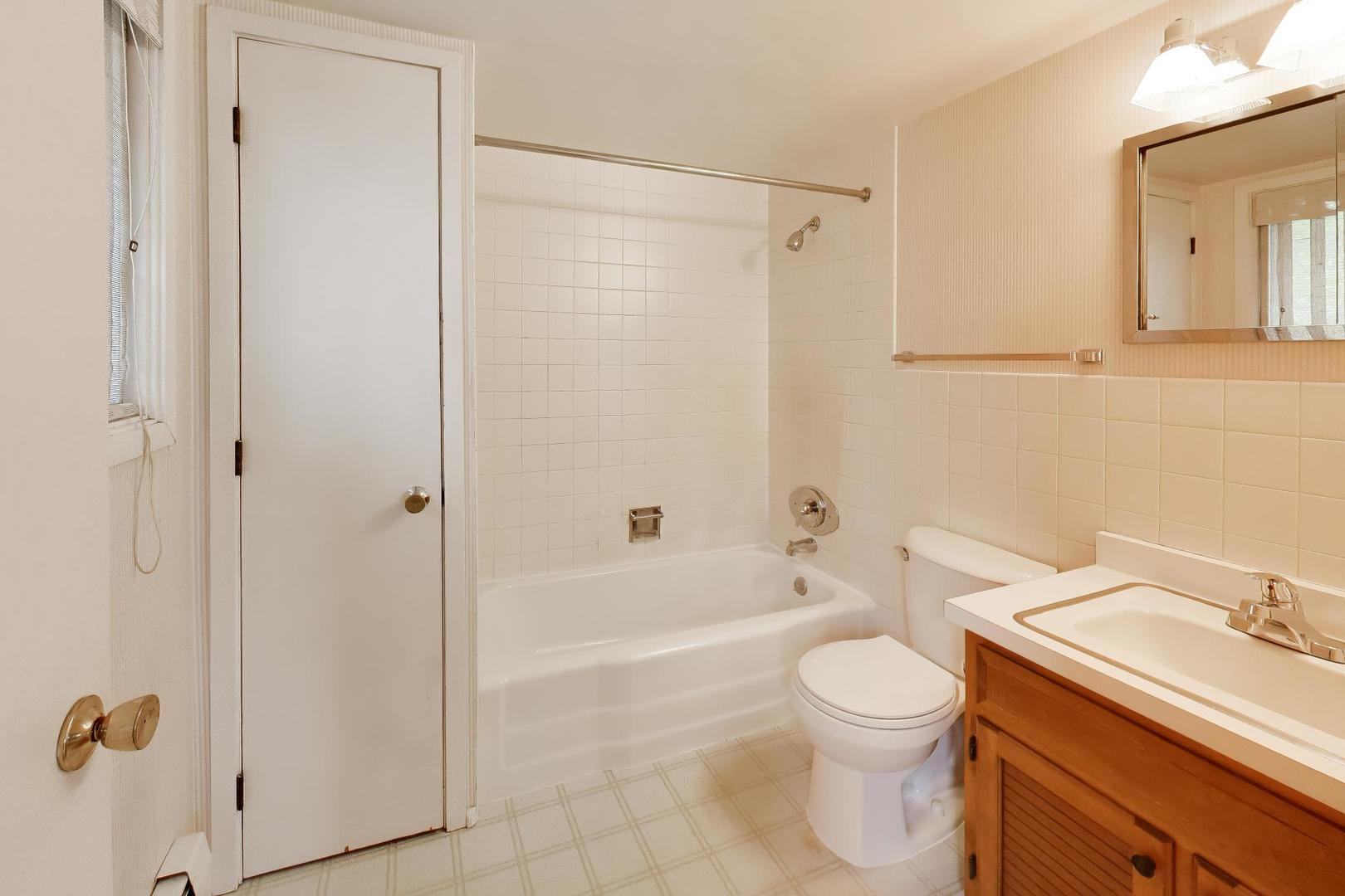 1056 Van Tassel Road Sleepy Hollow, IL 60118 - Photo 20 of 34 a bathroom with a toilet a sink and shower