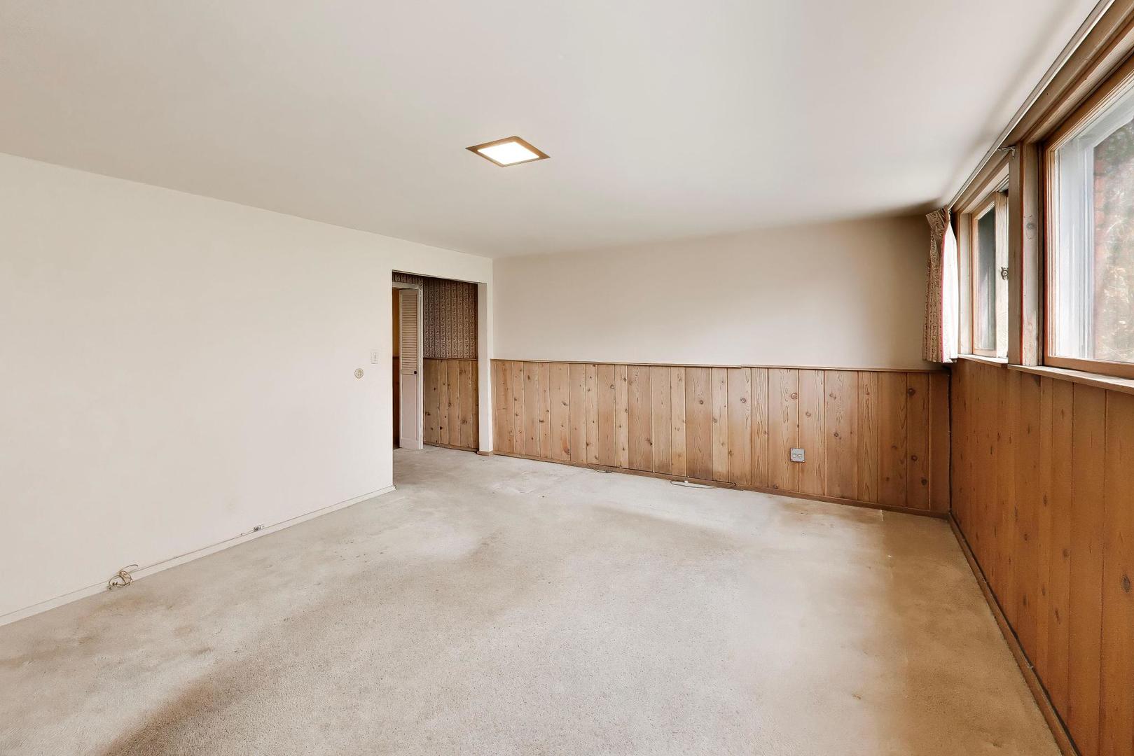 1056 Van Tassel Road Sleepy Hollow, IL 60118 - Photo 23 of 34 an empty room with windows