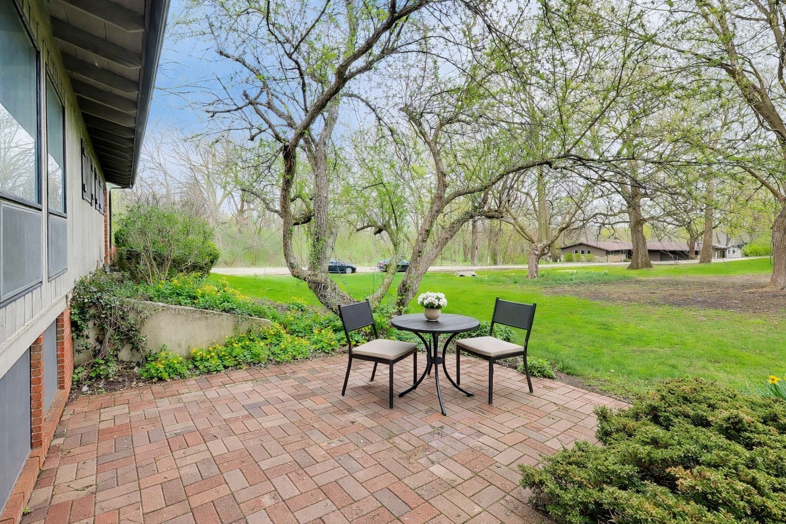 1056 Van Tassel Road Sleepy Hollow, IL 60118 - Photo 27 of 34 a patio with table and chairs and potted plants
