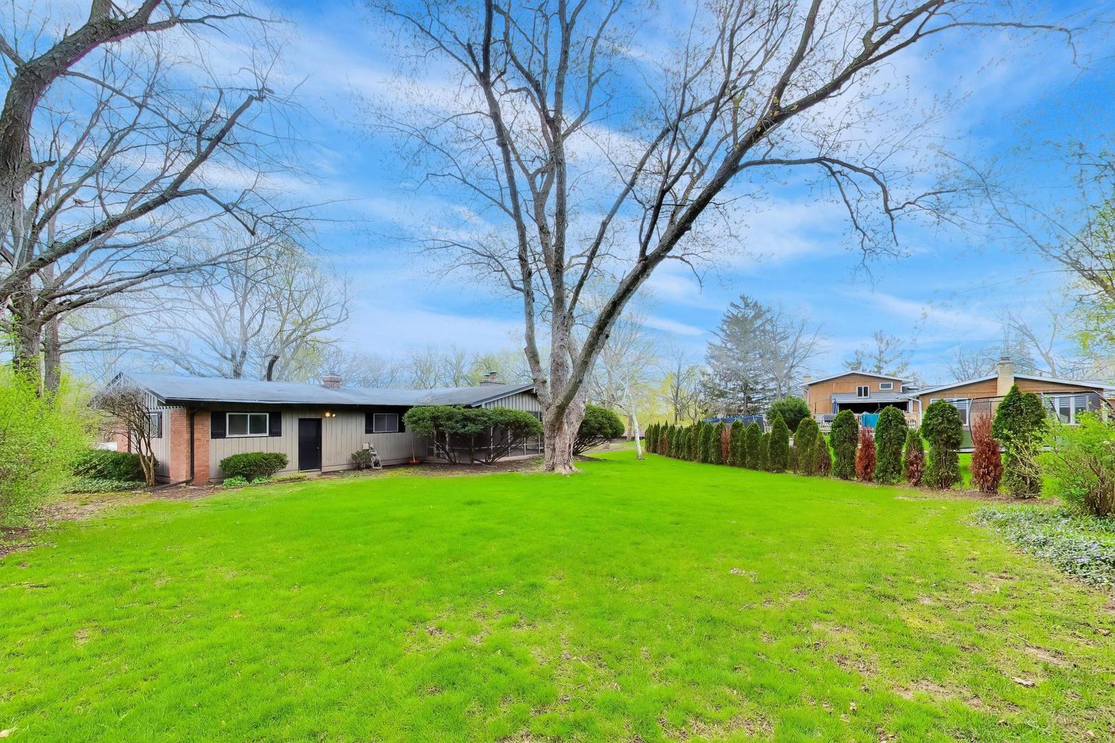 1056 Van Tassel Road Sleepy Hollow, IL 60118 - Photo 34 of 34 a view of a house with a yard