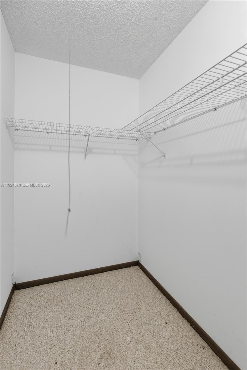 9230 Southwest 101st Place Ocala, FL 34481 - Photo 12 of 30 a view of a room with racks on the wall