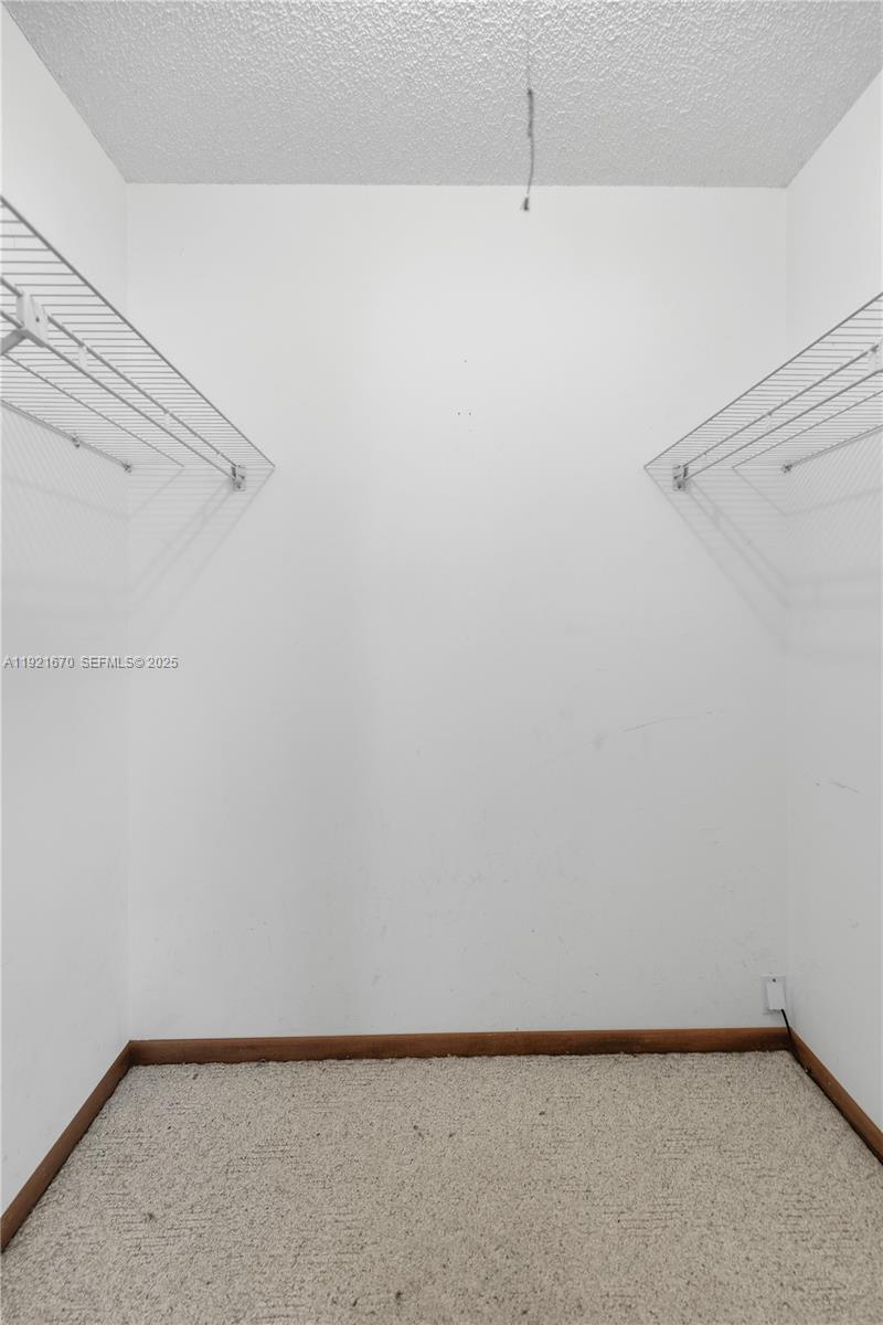 9230 Southwest 101st Place Ocala, FL 34481 - Photo 16 of 30 a view of a room with racks on the wall