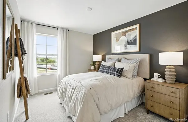a bathroom with a sink toilet and mirror
