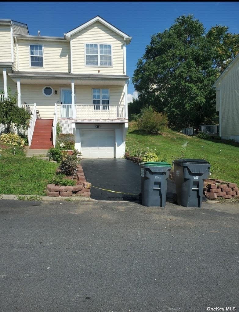 a couple of table and chairs in front of house
