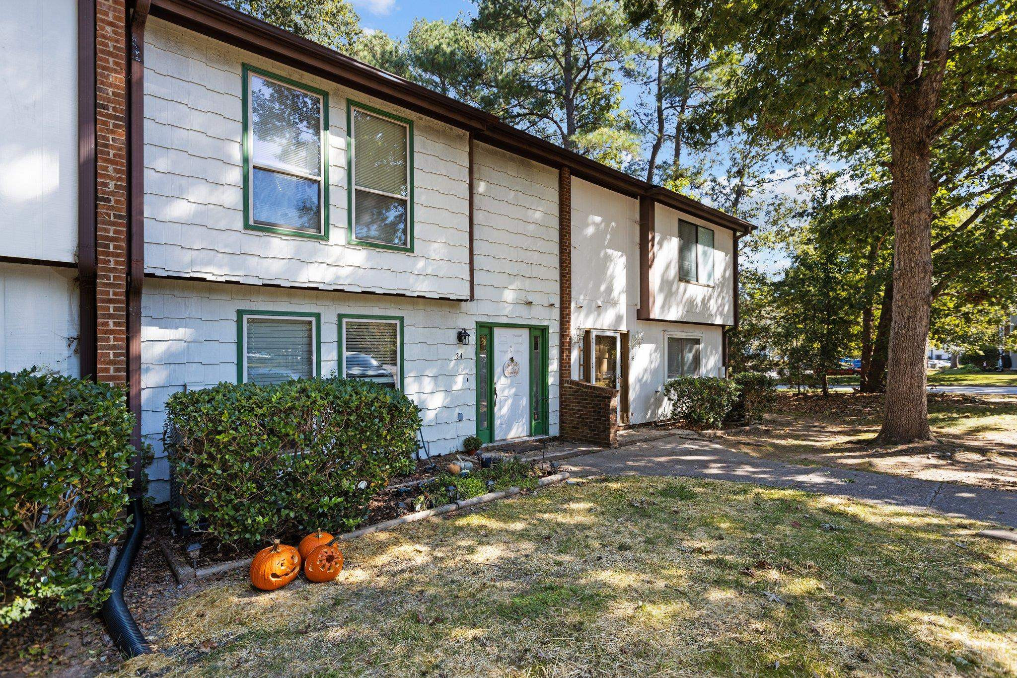 1227 Seaton Road, Unit 34 Durham, NC 27713 - Photo 1 of 32 a view of a house with a yard
