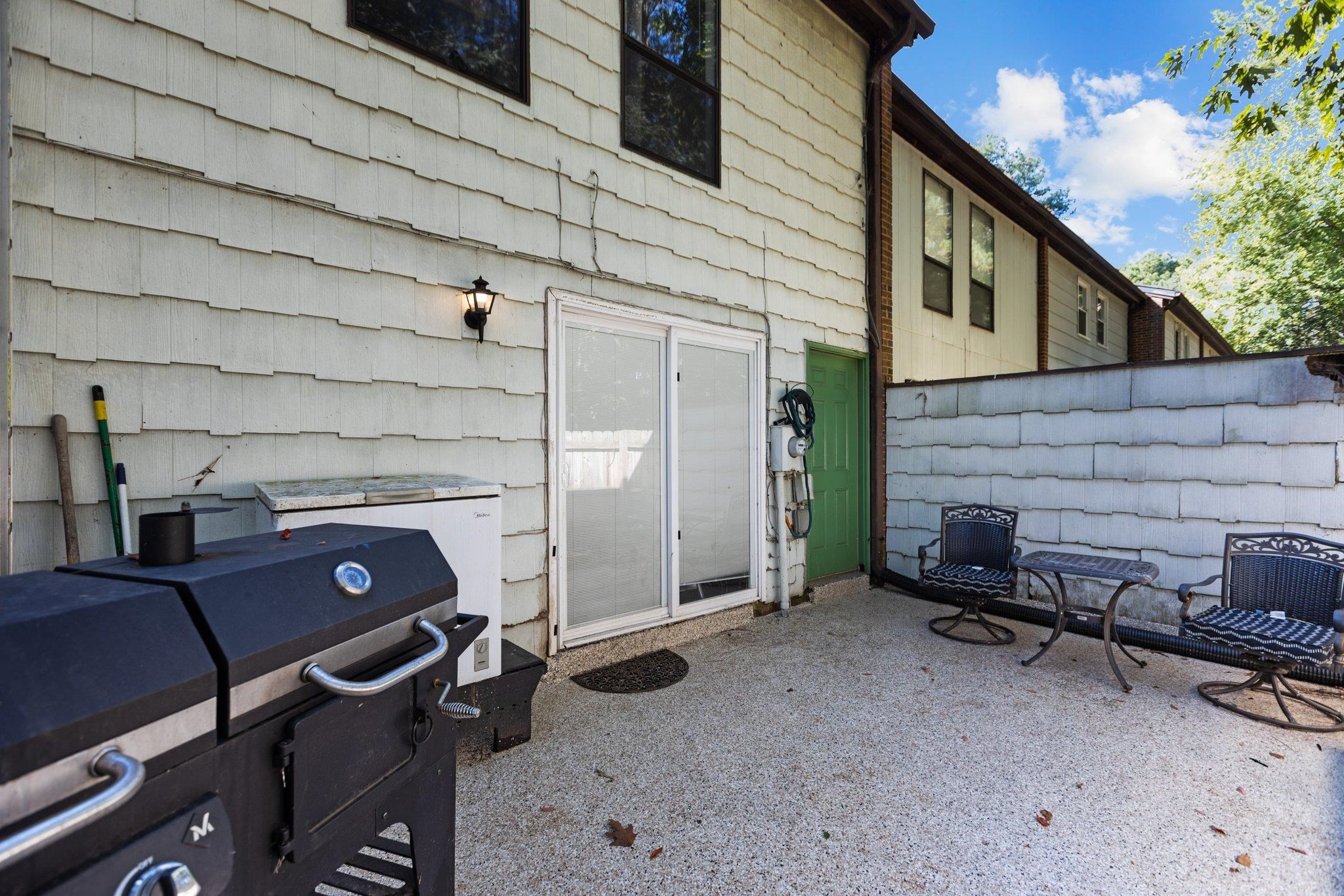 1227 Seaton Road, Unit 34 Durham, NC 27713 - Photo 14 of 32 a view of a patio in back of house