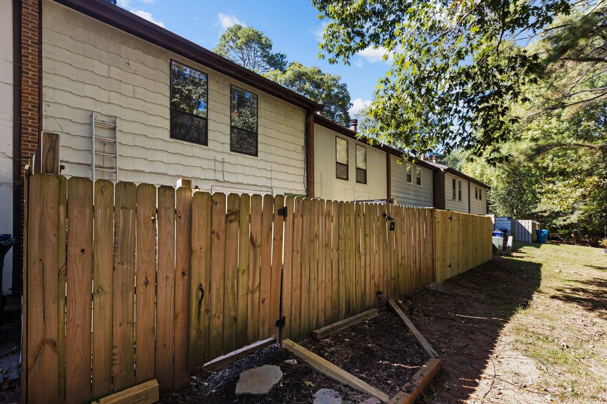 1227 Seaton Road, Unit 34 Durham, NC 27713 - Photo 16 of 32 a backyard of a house