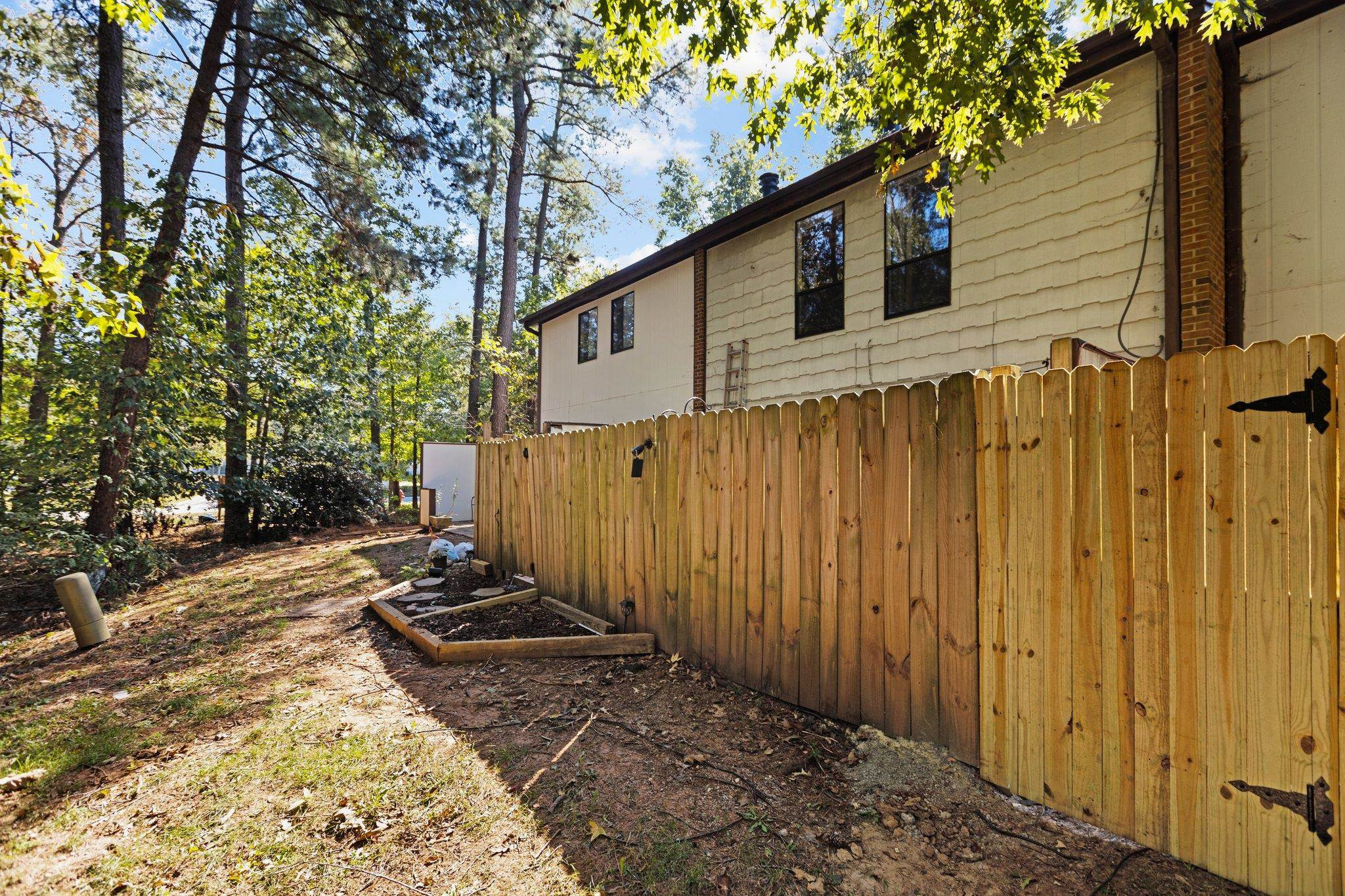 1227 Seaton Road, Unit 34 Durham, NC 27713 - Photo 17 of 32 a front view of a house with a yard