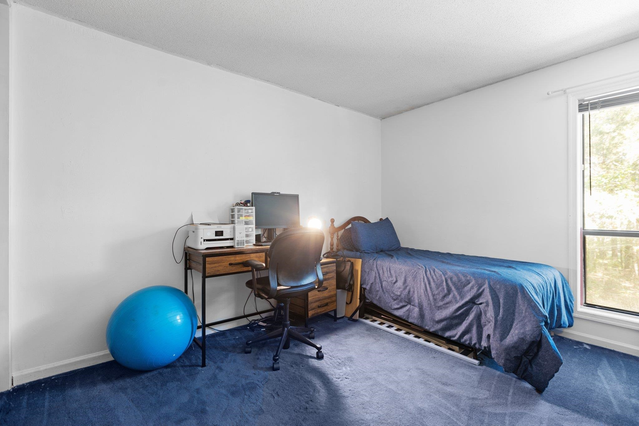 1227 Seaton Road, Unit 34 Durham, NC 27713 - Photo 21 of 32 a bedroom with a bed and a window