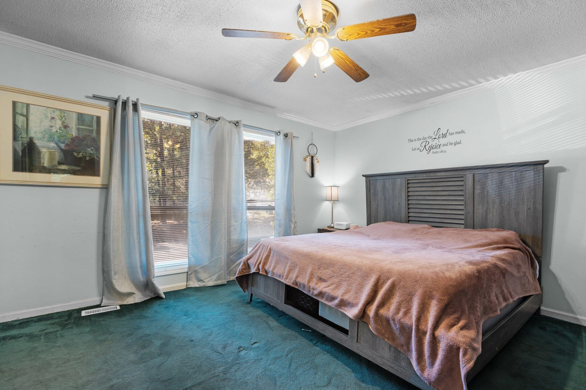 1227 Seaton Road, Unit 34 Durham, NC 27713 - Photo 25 of 32 a bed sitting in a spacious bedroom next to a window