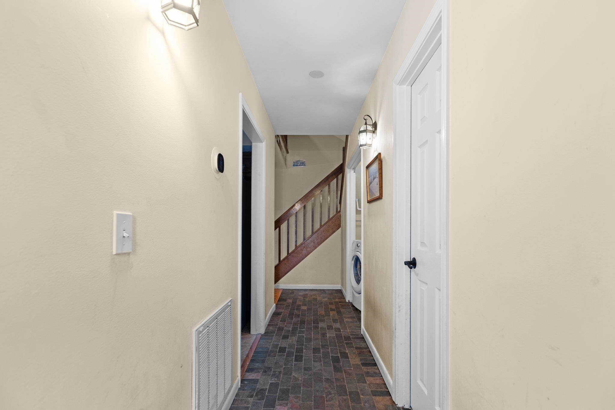 1227 Seaton Road, Unit 34 Durham, NC 27713 - Photo 3 of 32 a view of a hallway with the wooden floor