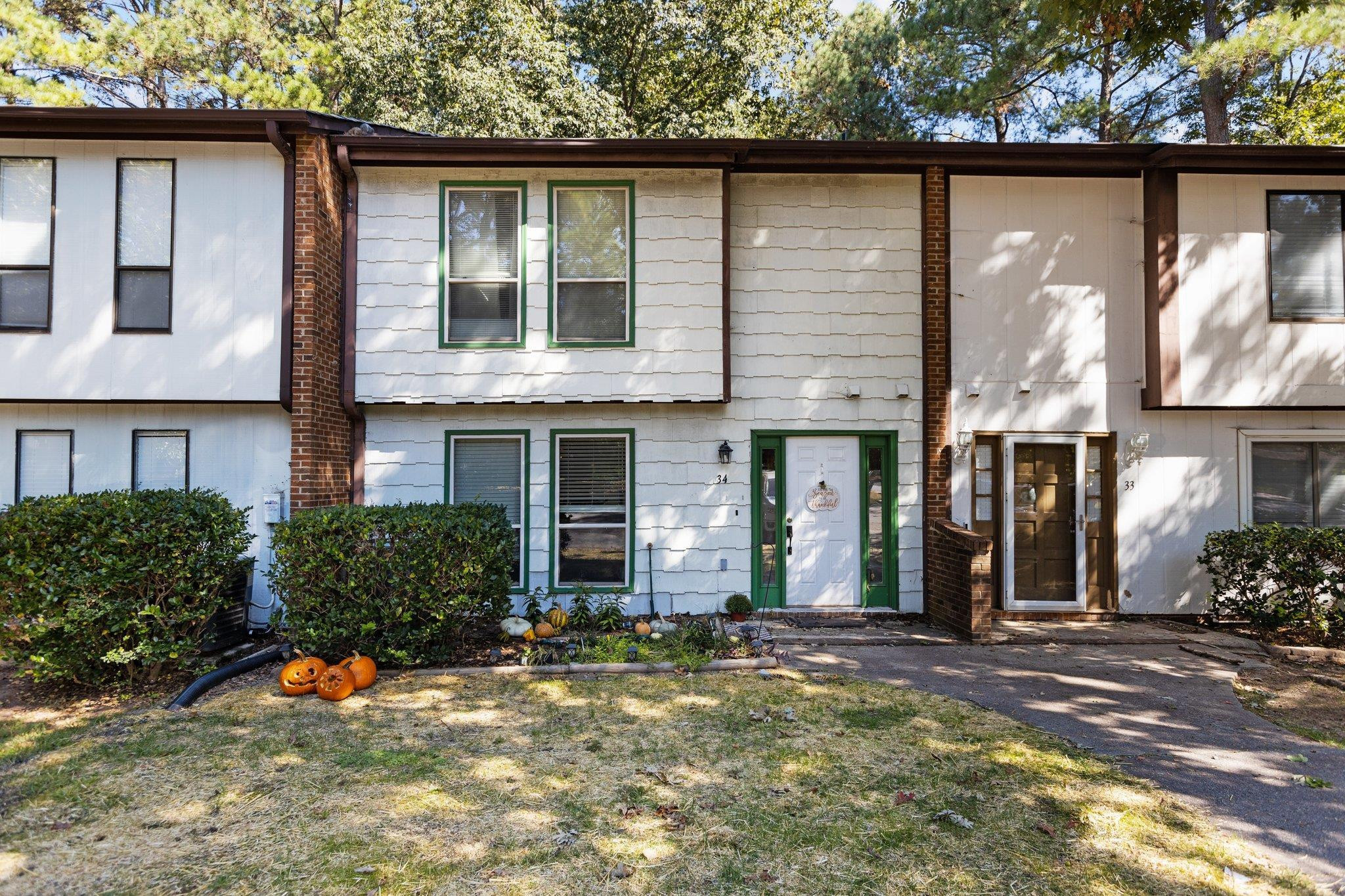 1227 Seaton Road, Unit 34 Durham, NC 27713 - Photo 32 of 32 a front view of a house with a yard