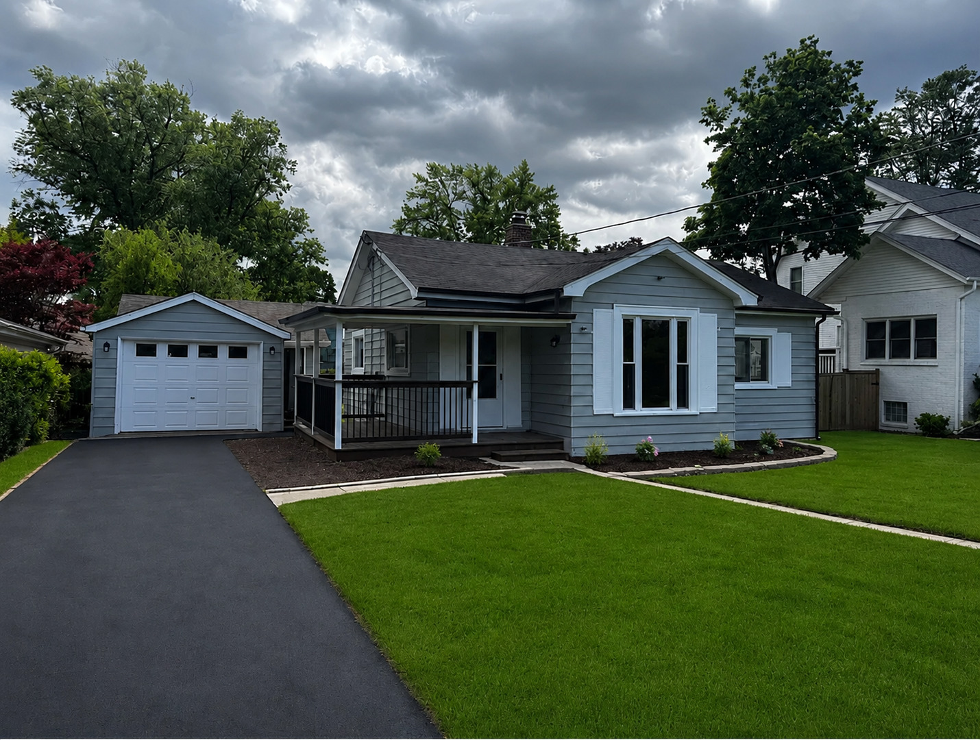 722 East Indiana Street Wheaton, IL 60187 - Photo 1 of 10 a front view of a house with a yard