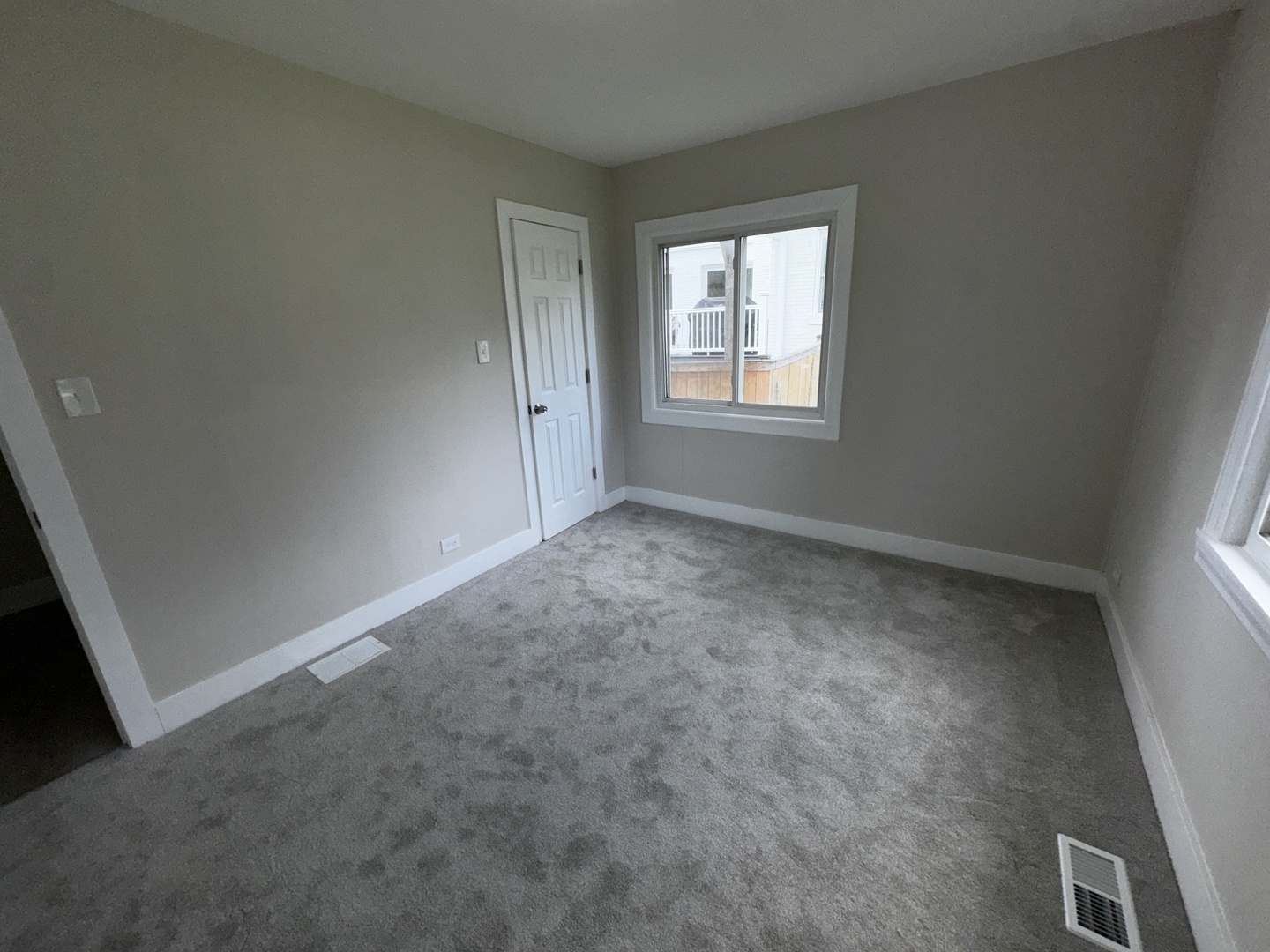 722 East Indiana Street Wheaton, IL 60187 - Photo 2 of 10 an empty room with windows