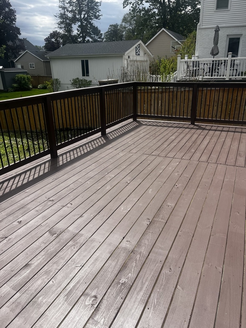 722 East Indiana Street Wheaton, IL 60187 - Photo 8 of 10 a view of deck with wooden floor and yard in the back