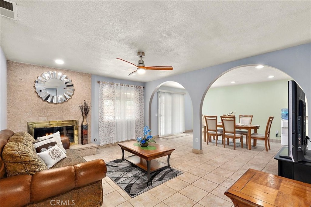 2914 West Wilson Street Banning, CA 92220 - Photo 12 of 31 a living room with furniture and a fireplace