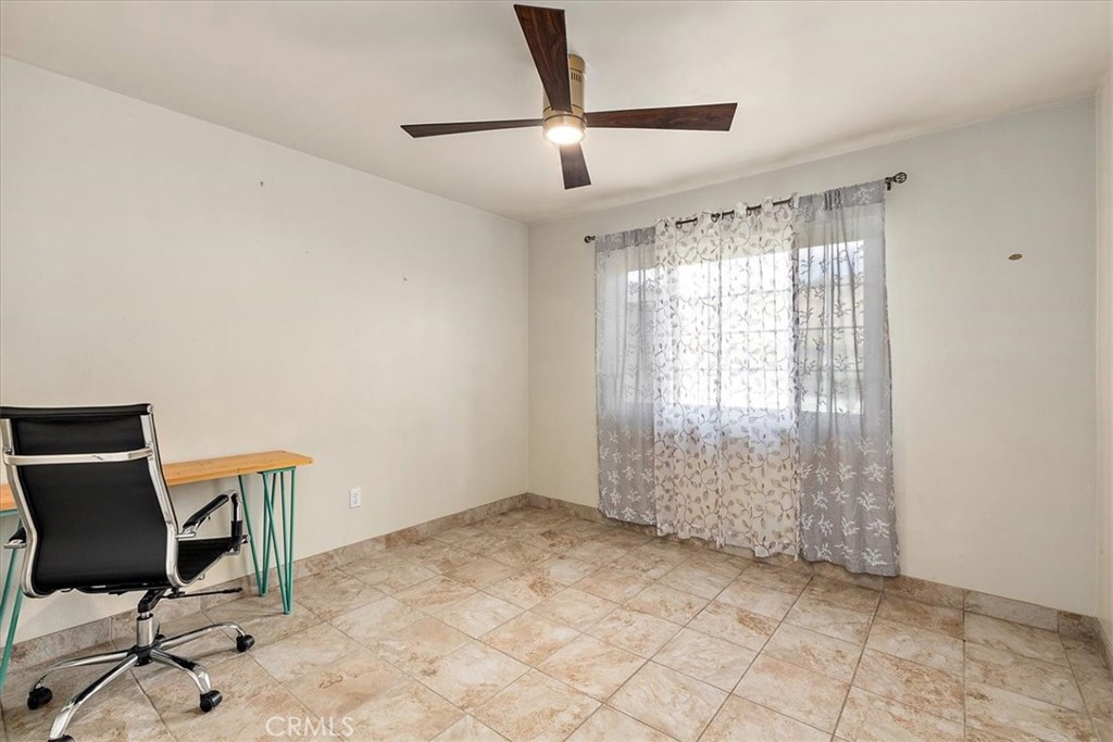 2914 West Wilson Street Banning, CA 92220 - Photo 17 of 31 a view of room with window and ceiling fan