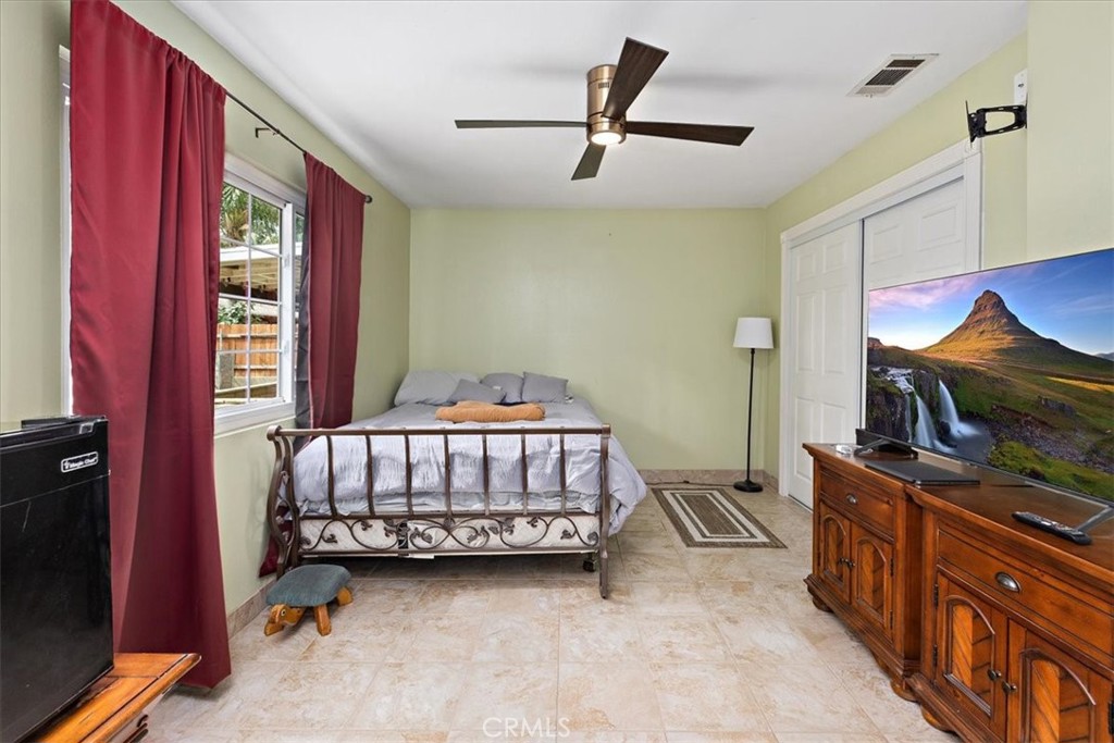 2914 West Wilson Street Banning, CA 92220 - Photo 19 of 31 a bedroom with furniture and a window