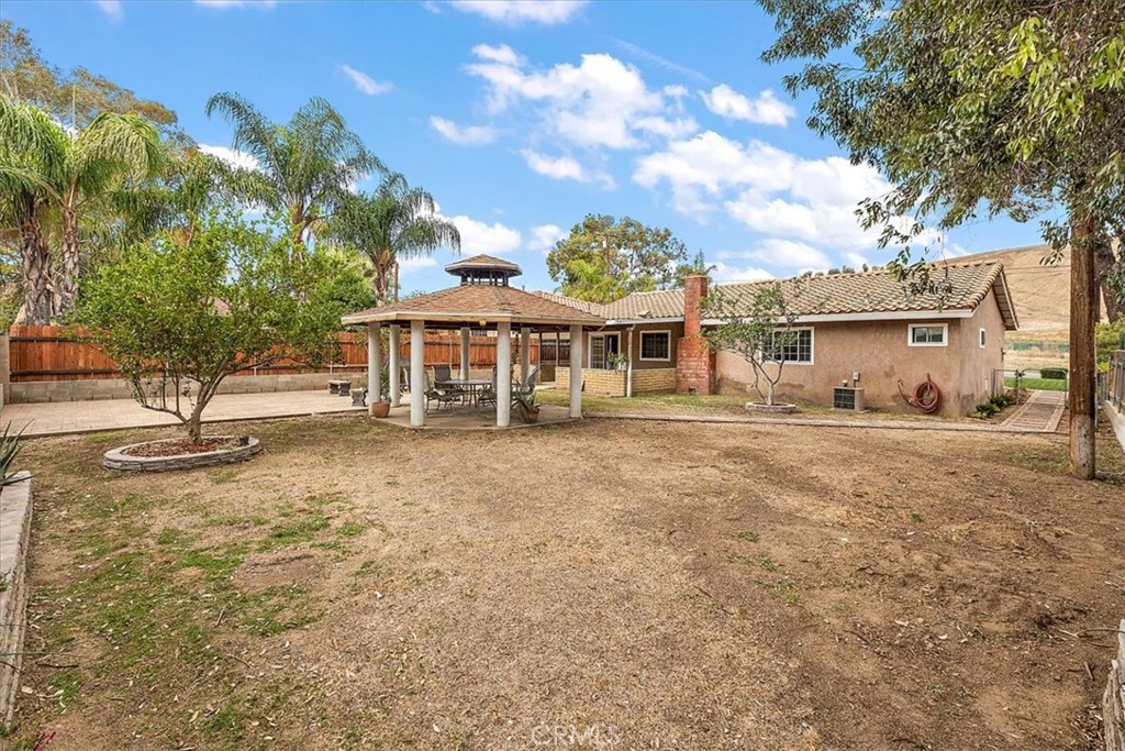 2914 West Wilson Street Banning, CA 92220 - Photo 24 of 31 a view of a house with a yard and sitting area