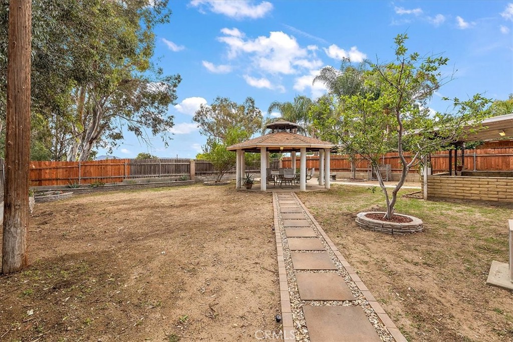 2914 West Wilson Street Banning, CA 92220 - Photo 25 of 31 a backyard of a house with table and chairs